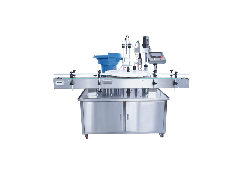 Rotating disc screw cap machine